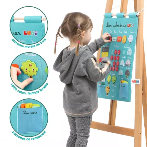 Calendrier pour enfant. Apprendre à lire la date et à s’organiser dans le temps. Notion du temps qui passe : années, mois, jours, saisons, météo. Calendrier en tissu, 100% coton. Étiquettes en feutrine. Référence produit : 2096.