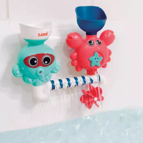 Aqua Game set from LUDI. This fun water circuit is attached to the walls using suction cups. The water inserted from the top flows out and turns the mill. For children over 10 months. Product reference 40009.